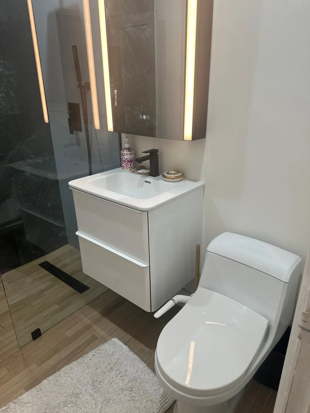 A closer look at the vanity, mirror and finishes in this bathroom renovation.